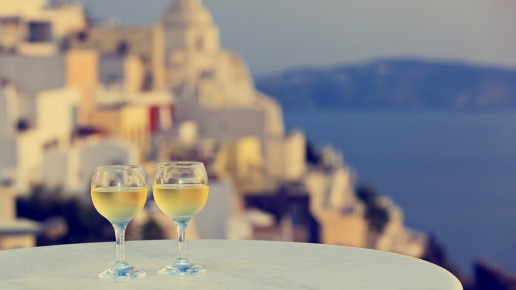 Enjoy a glass of local wine from one of Santorini's romantic terraces